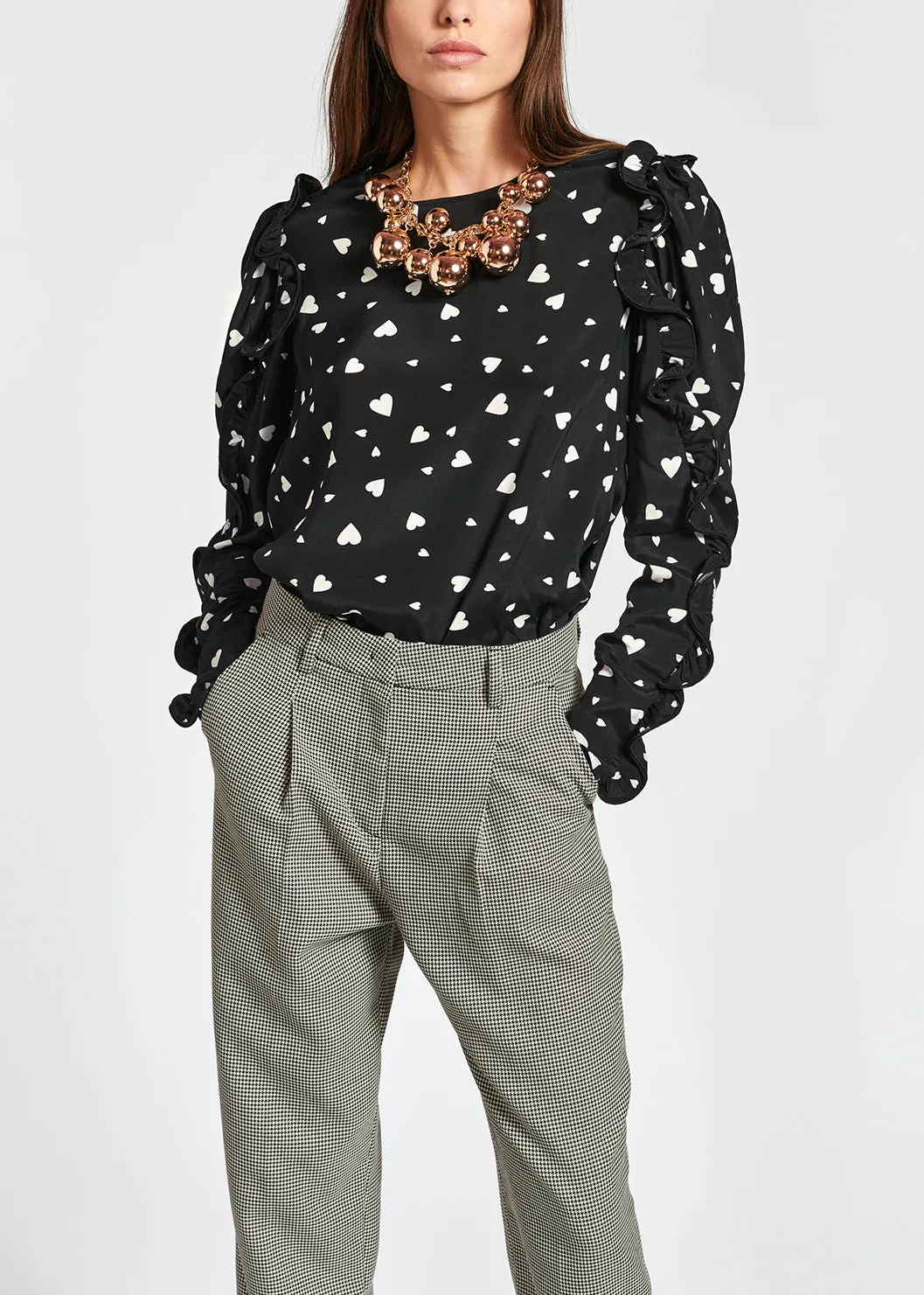 Black heart-print top with ruffled sleeves