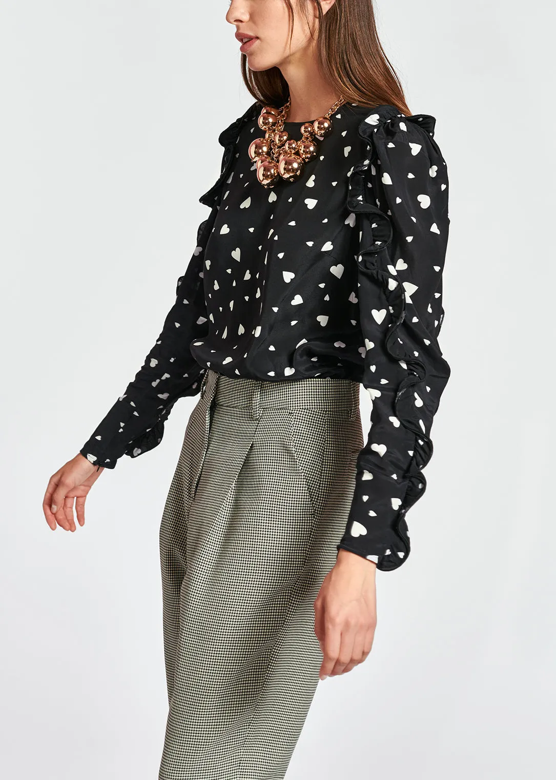 Black heart-print top with ruffled sleeves