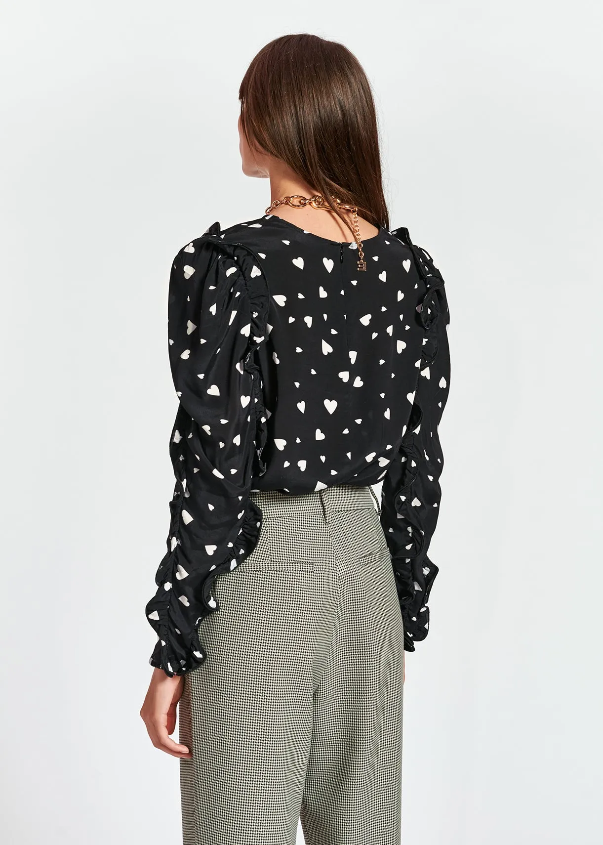 Black heart-print top with ruffled sleeves