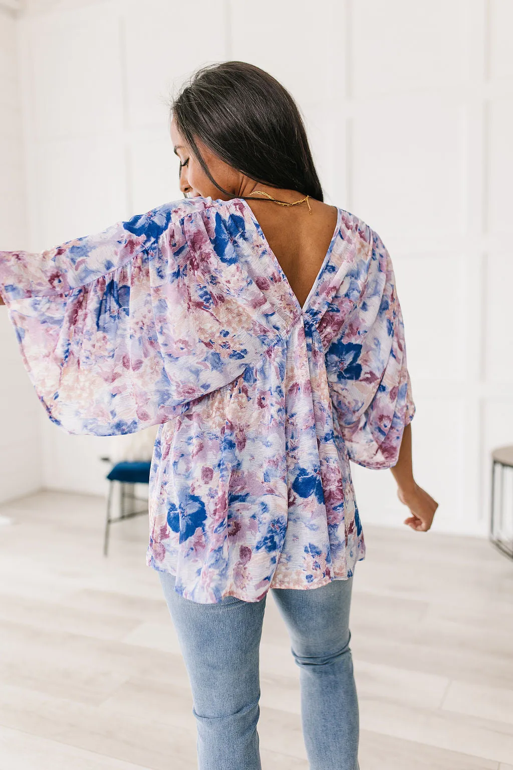 Fabled in Floral Draped Peplum Top in Blue!