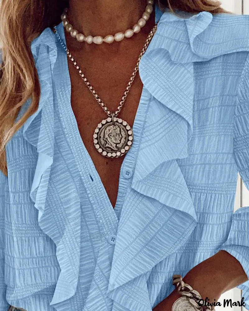 Xieyinshe - Textured Long Sleeve Blouse with Ruffled Hem
